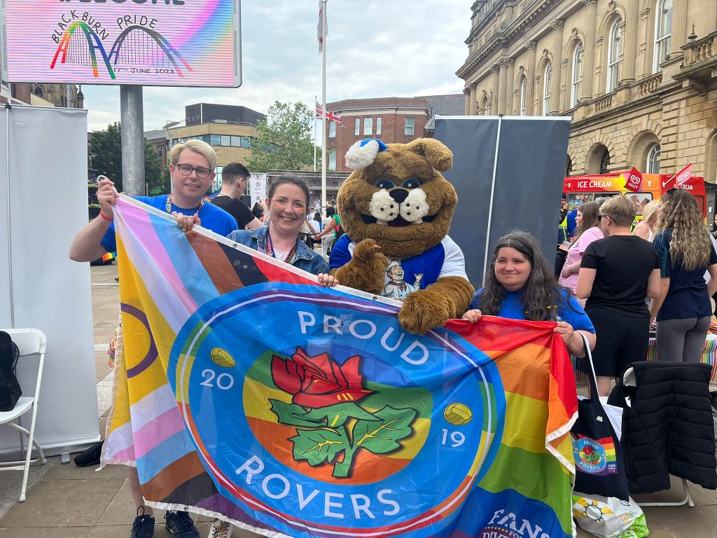 Proud Rovers Committee Members at Blackburn Pride with Rover the dog.